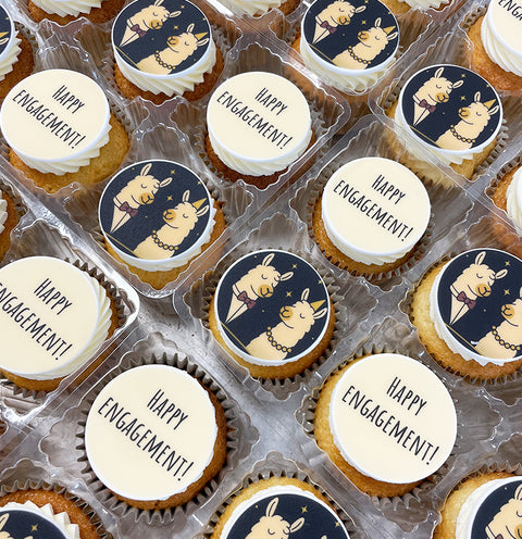 happy engagement cupcakes with edible image toppers ready to be delivered via courier