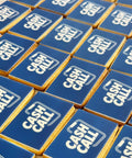 Rectangle shaped logo biscuits photographed in Print Cakes bakery and ready to be delivered for a London event