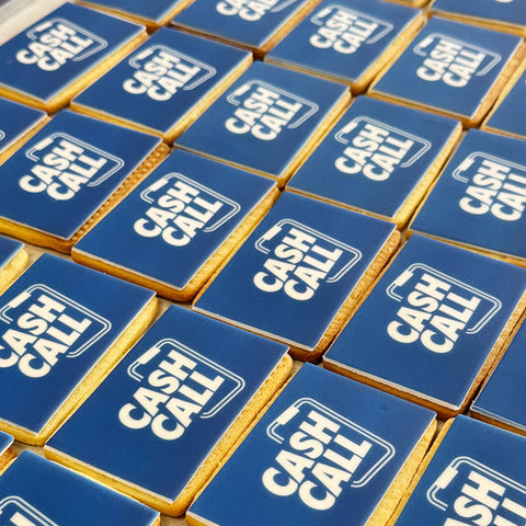 Rectangle shaped logo biscuits photographed in Print Cakes bakery and ready to be delivered for a London event