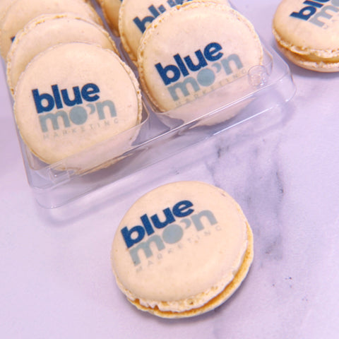 branded macarons with company logo printed onto them. 