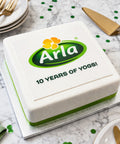 CELEBRATION CAKE WITH COMPANY LOGO FOR AND MESSAGE FOR ANNIVERSARY EVENT