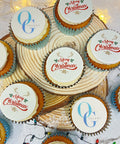 branded christmas cupcakes with merry christmas design on vanilla buttercream and logos