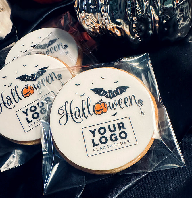 Halloween-themed cookies with customisable logo. UK delivery, shop www.printcakes.co.uk