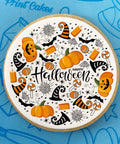 Halloween branded biscuit with pumpkins, bats, cobwebs, witch hats and sweets design on edible icing.