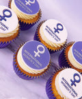 cupcakes for international women's day in purple cases with IWD logo