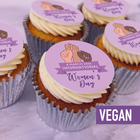 Vegan Cupcakes with Women's Day-themed toppers on a purple background