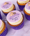 Cupcakes with International Women's Day-themed toppers in purple cases