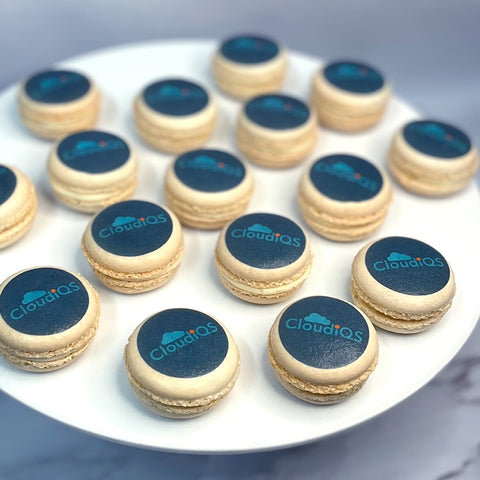 Customised macarons with printed logo on a white plate