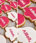 branded biscuits in a bell shape like the company logo with an edible print of the logo on the icing. 