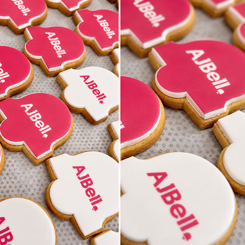 branded biscuits in a bell shape like the company logo with an edible print of the logo on the icing. 
