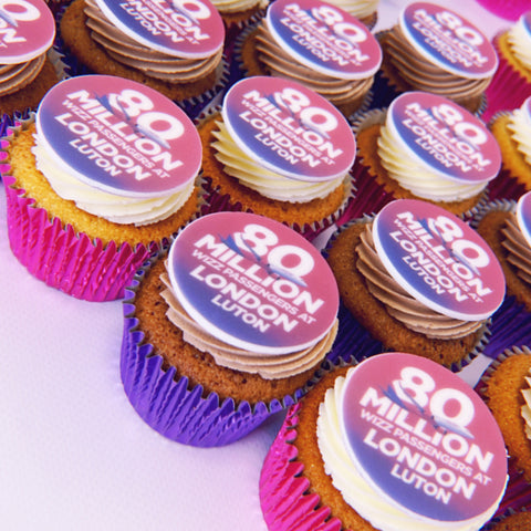 Cupcakes for London Luton Airport celebration with branded message toppers.