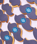 movember moustache shaped biscuits with icing and a company logo.