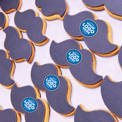 movember moustache shaped biscuits with icing and a company logo.