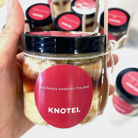 Vanilla cake jar with jam and branded logo sticker for event