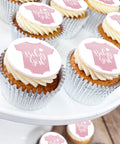 baby girl cupcakes for gifts and baby showers. Cute baby grow iced design