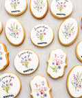 Bespoke branded biscuits with company logo and watercolour floral designs in round and custom shapes