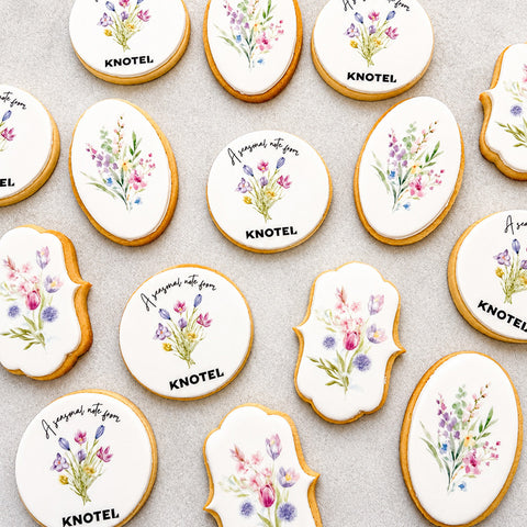 Bespoke branded biscuits with company logo and watercolour floral designs in round and custom shapes