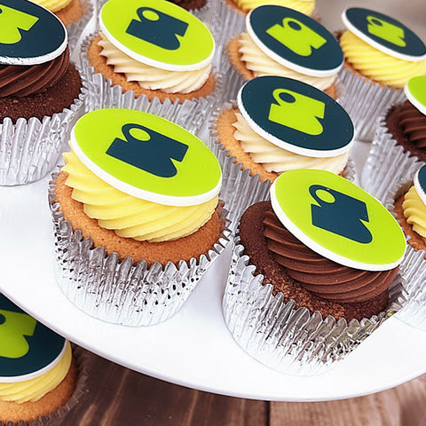 lemon , vanilla and chocolate branded cupcakes with two designs for trade show giveaway