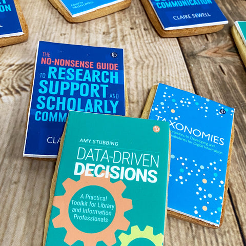 book shaped biscuits with edible prints of book covers 