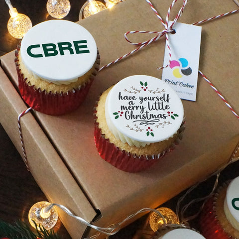 Branded Christmas cupcake box with a company logo topper in a red case.