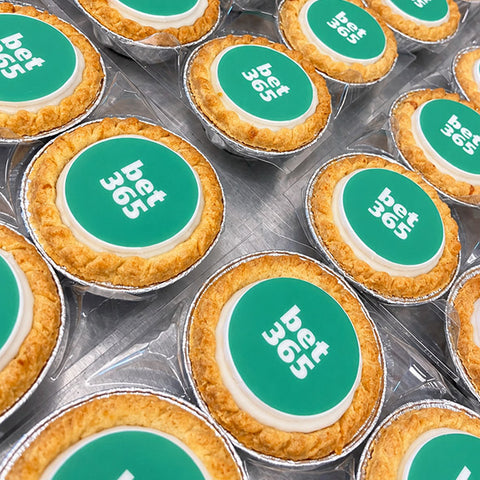 Branded mince pies with a green company logo printed on edible iced toppers
