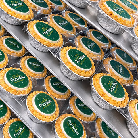 Trays of logo mince pies in foil cases with a festive branded Christmas message
