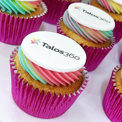 cupcake with branded logo topper and matching coloured buttercream with 3 colours