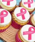 Close-up of pink ribbon cupcakes for Breast Cancer Awareness Month office events
