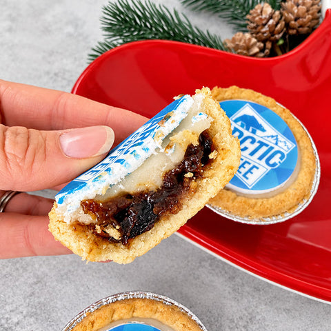 Company branded mince pie showing shortcrust pastry and fruit mincemeat filling