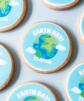 biscuits decorated with an earth day theme - earth image and april 22nd date. Delivery uk wide