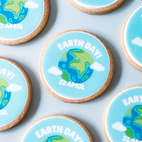 biscuits decorated with an earth day theme - earth image and april 22nd date. Delivery uk wide