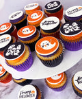 happy halloween ghost cupcakes with coloured buttercream for halloween parties and gifts