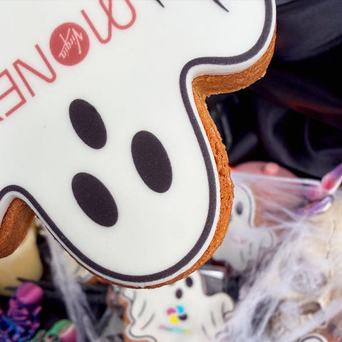ghost biscuit made of gingerbread with a spooky face and company logo