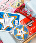 Employee gift box with branded biscuit, tea bag and corporate thank you treats
