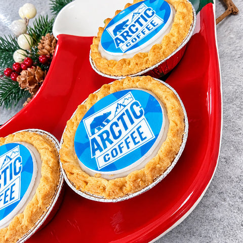 Logo mince pies with a bespoke edible printed company logo on a red Christmas plate