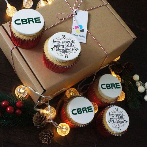 Box of Merry Little Christmas branded cupcakes for corporate Christmas gifts