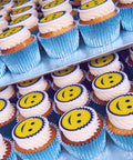 smiley face cupcakes with edible image for product launch. uk delivery