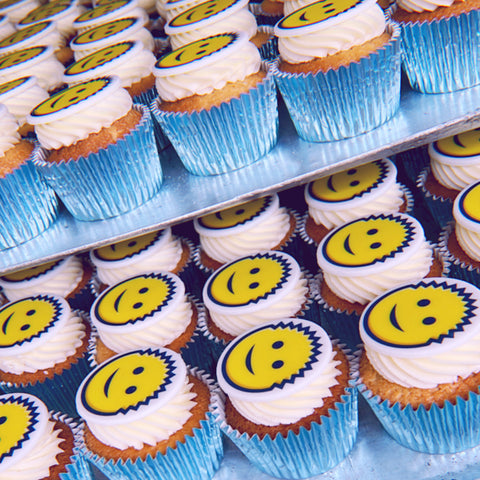 smiley face cupcakes with edible image for product launch. uk delivery