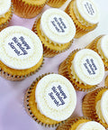 Personalised message cupcakes with Happy Birthday message edible image toppers. In gold cases.