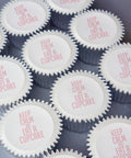 Cupcakes with "Keep Calm and eat a cupcake" printed on top in pink