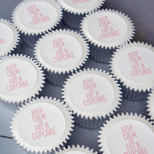 Cupcakes with "Keep Calm and eat a cupcake" printed on top in pink