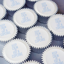 Cupcakes with "Keep Calm and eat a cupcake" printed on top in blue